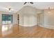 Open living area with wood floors and sliding glass doors leading to the outside at 3510 Shawn St, Punta Gorda, FL 33980