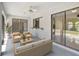 Covered patio with neutral furniture and sliding glass doors leading to the backyard at 3510 Shawn St, Punta Gorda, FL 33980