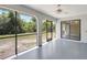 Enclosed patio showcasing views of the private backyard and a ceiling fan at 3510 Shawn St, Punta Gorda, FL 33980