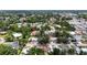 This aerial shows homes in a tree filled neighborhood with sidewalks, close to schools, parks and recreational facilities at 3616 Stardust Pl, Sarasota, FL 34232