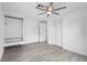 This bedroom boasts light floors, built-in closet space, a ceiling fan, and plenty of natural light at 3616 Stardust Pl, Sarasota, FL 34232