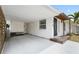 Attached carport offering convenient covered parking and access to the home's entrance and side yard at 3616 Stardust Pl, Sarasota, FL 34232