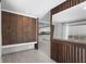 Bright hallway with hardwood floors, built-in storage, and view into the kitchen at 3616 Stardust Pl, Sarasota, FL 34232