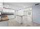 Open kitchen with island featuring stainless steel appliances and granite countertops at 3616 Stardust Pl, Sarasota, FL 34232