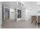 Versatile room with tile flooring, access to the kitchen, and potential for dining or entertaining at 3616 Stardust Pl, Sarasota, FL 34232