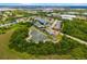 An aerial view featuring homes nestled between ponds and lush greenery with a red pinpoint at 370 Londonderry Dr, Sarasota, FL 34240