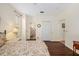 Bedroom with hardwood floors, a ceiling fan, a view of an en-suite bathroom and closet at 370 Londonderry Dr, Sarasota, FL 34240