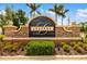 Elegant Legends at Tatum Ridge stone community entrance sign with manicured landscaping and palm trees at 370 Londonderry Dr, Sarasota, FL 34240