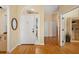 Welcoming home foyer with hardwood floors, a white front door, and neutral wall colors at 370 Londonderry Dr, Sarasota, FL 34240