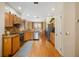 Bright kitchen featuring hardwood floors, stainless steel appliances, granite countertops, and ample cabinet space at 370 Londonderry Dr, Sarasota, FL 34240