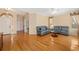 Spacious living room featuring hardwood floors, neutral walls, modern furniture, and natural light at 370 Londonderry Dr, Sarasota, FL 34240
