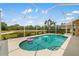 Relaxing pool area with a screened enclosure, offering privacy and scenic views at 370 Londonderry Dr, Sarasota, FL 34240