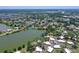 Scenic aerial view of the property with a lake backdrop and the expansive neighborhood beyond at 415 Courbet Dr # 415, Nokomis, FL 34275