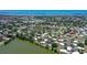 An aerial view of waterfront homes with a lake, bay, and beautiful landscaping at 415 Courbet Dr # 415, Nokomis, FL 34275