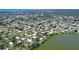 An aerial view of waterfront homes with a lake, bay, and beautiful landscaping at 415 Courbet Dr # 415, Nokomis, FL 34275