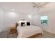 Cozy bedroom features a ceiling fan, wood frame bed and matching nightstands, and recessed lighting at 415 Courbet Dr # 415, Nokomis, FL 34275