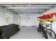 Spacious garage with epoxy flooring, ample storage, and a separate door to the exterior at 415 Courbet Dr # 415, Nokomis, FL 34275