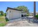 Side view of the detached garage featuring a clean design and private driveway access at 415 Courbet Dr # 415, Nokomis, FL 34275