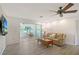 Living room with waterfront views and a unique driftwood sculpture at 415 Courbet Dr # 415, Nokomis, FL 34275