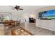 Bright, open living area with a dining table and outdoor access at 415 Courbet Dr # 415, Nokomis, FL 34275