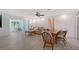 Open floor plan living room with water views from enclosed porch area at 415 Courbet Dr # 415, Nokomis, FL 34275