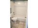 The bathroom features a bathtub with white tiling and an updated toilet and vanity at 4304 78Th W St # 4304, Bradenton, FL 34209