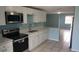 Well-equipped kitchen with stainless steel appliances, white cabinets, and stone countertops at 4304 78Th W St # 4304, Bradenton, FL 34209