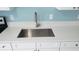 Close-up of a stainless steel sink with stone countertop and white cabinets at 4304 78Th W St # 4304, Bradenton, FL 34209