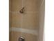 Showerhead with tan tiling and a decorative band around the middle at 4304 78Th W St # 4304, Bradenton, FL 34209