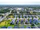 Scenic aerial view of a charming neighborhood featuring well-manicured lawns and a tranquil lake at 4315 Deep Creek Ter, Parrish, FL 34219