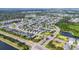 Expansive aerial view showcasing a vibrant residential community with beautiful homes, scenic ponds, and lush greenery at 4315 Deep Creek Ter, Parrish, FL 34219