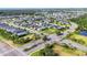 Gorgeous aerial view of a meticulously planned community with lush landscaping, lakes, and well-maintained homes at 4315 Deep Creek Ter, Parrish, FL 34219