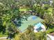 Aerial view of the community full-size basketball court, trees, and shaded seating area at 4315 Deep Creek Ter, Parrish, FL 34219