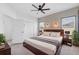 Main bedroom featuring modern decor, a ceiling fan, and carpet, offering a relaxing retreat at 4315 Deep Creek Ter, Parrish, FL 34219