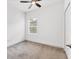 Cozy bedroom with a ceiling fan, neutral carpet, and natural light from the window at 4315 Deep Creek Ter, Parrish, FL 34219