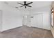 Spacious bedroom featuring a ceiling fan, carpet, and ample closet space at 4315 Deep Creek Ter, Parrish, FL 34219
