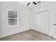 Bright bedroom with a closet, ceiling fan, and a window offering natural light at 4315 Deep Creek Ter, Parrish, FL 34219