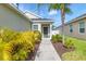 Close up of a single-story home with inviting front entrance framed by lush landscaping at 4315 Deep Creek Ter, Parrish, FL 34219