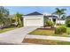 Inviting single-story home with a well-kept lawn and driveway, showcasing its curb appeal at 4315 Deep Creek Ter, Parrish, FL 34219