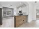 Modern kitchen featuring sleek stainless steel appliances, granite countertops, and bright white cabinetry at 4315 Deep Creek Ter, Parrish, FL 34219