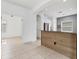 Modern kitchen featuring a wood breakfast bar and sleek stainless steel appliances at 4315 Deep Creek Ter, Parrish, FL 34219