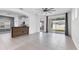 Open-concept living space with tiled floors and seamless flow to adjacent kitchen and backyard at 4315 Deep Creek Ter, Parrish, FL 34219