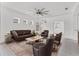 Spacious living room with modern furnishings, ceiling fan, and neutral colors, creating a comfortable atmosphere at 4315 Deep Creek Ter, Parrish, FL 34219