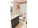Bathroom with a marble sink and floral shower curtain at 433 Cerromar Ln # 331, Venice, FL 34293