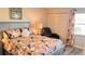 Beautifully decorated bedroom with floral bedding, a comfortable recliner, and closet at 433 Cerromar Ln # 331, Venice, FL 34293