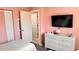 Bedroom featuring a dresser and door to a connecting room at 433 Cerromar Ln # 331, Venice, FL 34293