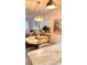 Dining area with a round table, chairs, and a chandelier at 433 Cerromar Ln # 331, Venice, FL 34293