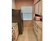 Galley kitchen featuring granite countertops and stainless steel appliances at 433 Cerromar Ln # 331, Venice, FL 34293