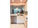 Bright kitchen features granite countertops, stainless steel appliances, and modern pendant lighting at 433 Cerromar Ln # 331, Venice, FL 34293
