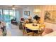 Open living space with dining table and chairs at 433 Cerromar Ln # 331, Venice, FL 34293
